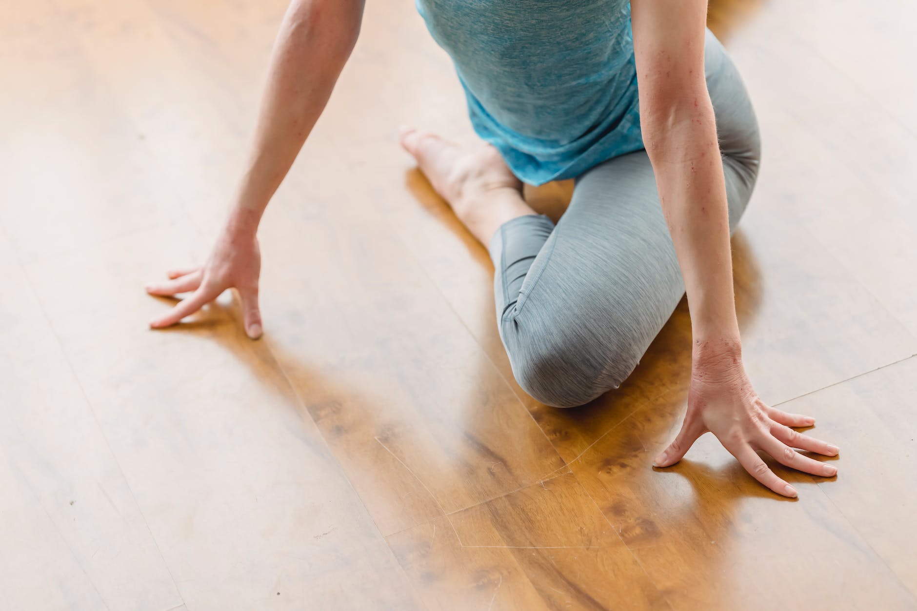 woman practicing yoga in pigeon pose